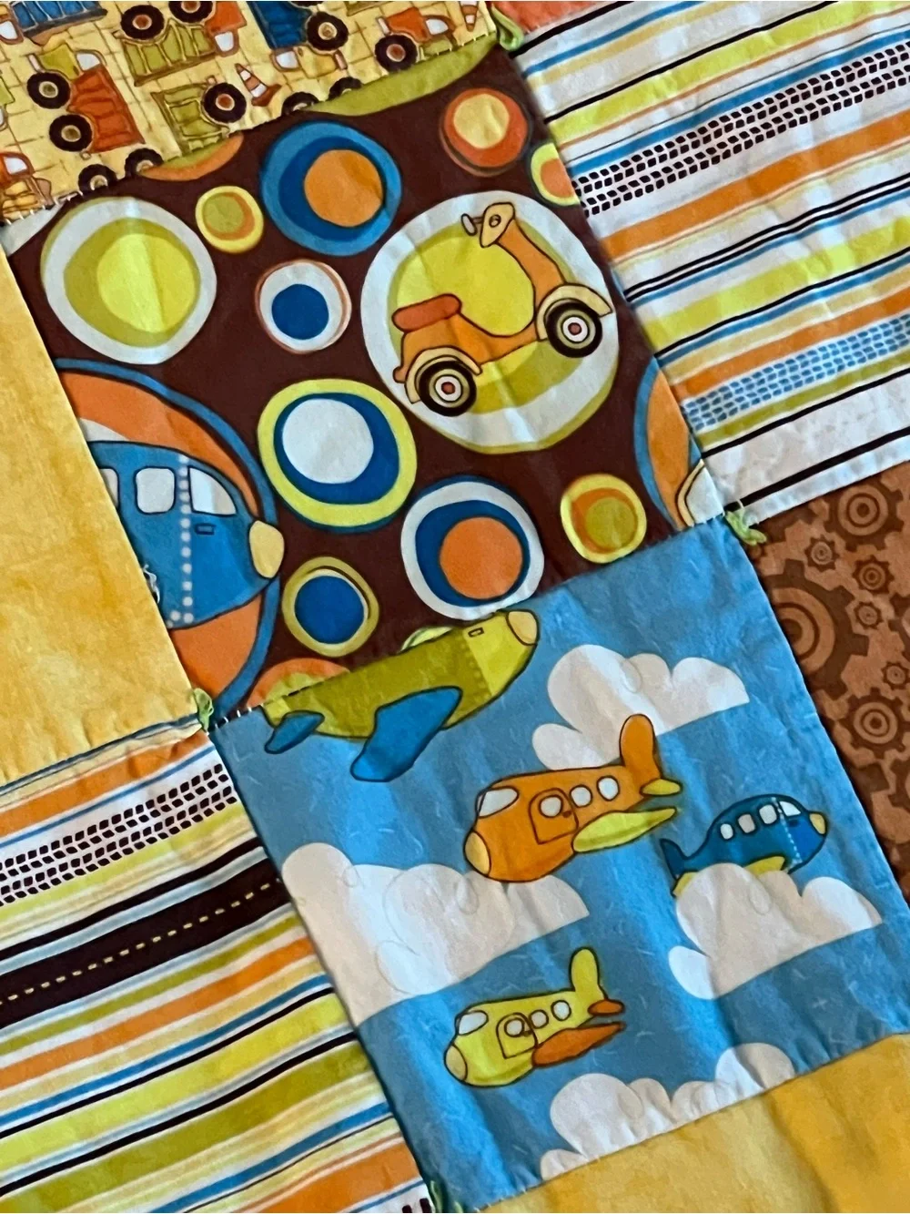 Patchwork Baby Quilt in Yellow, Blue, green 36x36” airplanes trucks car